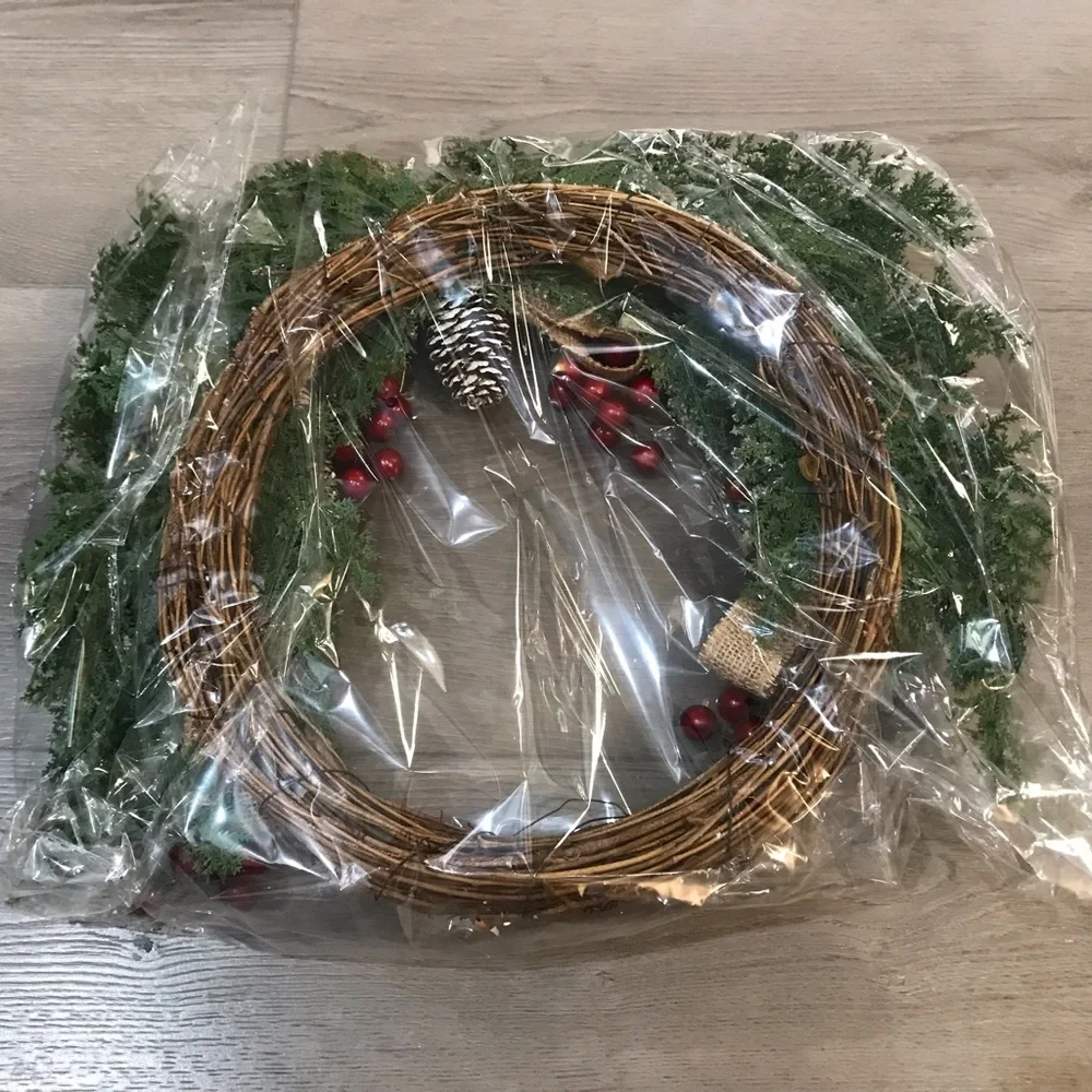 Festive Holiday Wreath with Red Berries, Pinecones and Artificial Snow